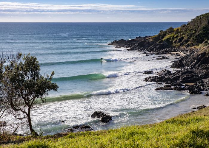  A lone surfer enjoys perfect waves at Crescent Head on the northern side of Racecourse Head.