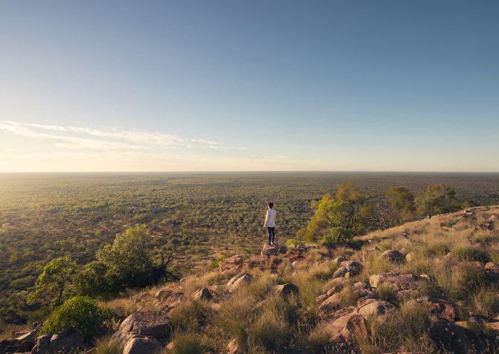 Man enjoying panoramic views from atop Mount Oxley near the town of Bourke