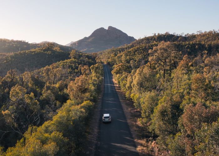 Scenic drive into Warrumbungle National Park with views through to Belougery Split Rock.