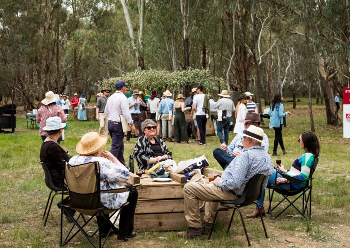 Guests enjoying their meal in a natural bush setting during Grazing Down the Lachlan in Forbes, Parkes, Country NSW