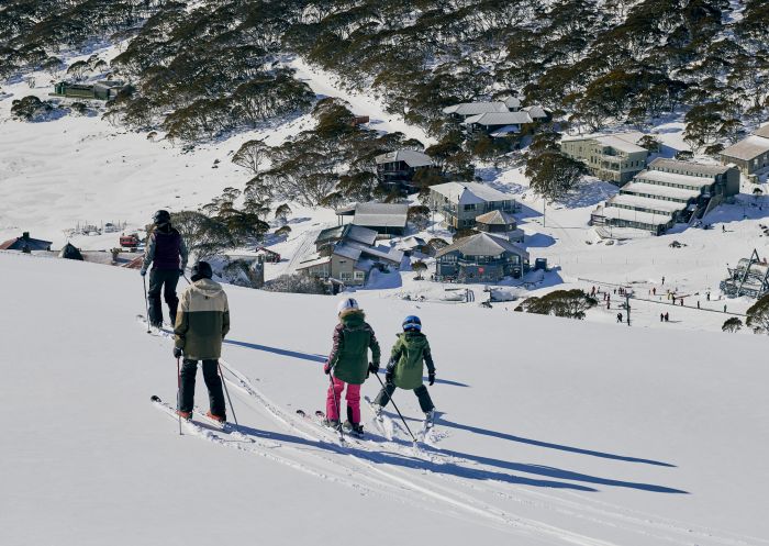Family enjoying a day of skiing at Charlotte Pass Ski Resort in the Snowy Mountains