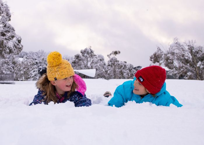 Kids having fun in the snow at Thredbo in Kosciuszko National Park, Snowy Mountains