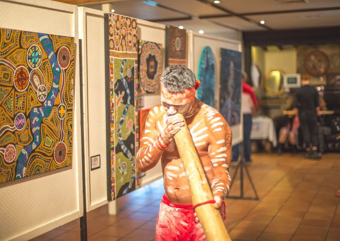 Performer playing the yidaki at Wupa@Wanaruah Aboriginal Art Exhibition and Trail in Pokolbin, Hunter Valley