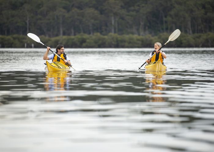 Couple enjoying the Oyster Tasting Kayak Tour on the Clyde River, Batemans Bay with tour operator Region X