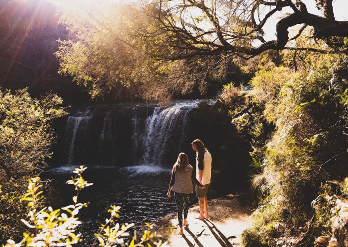 Couple at waterfall at Nellies Glen, Budderoo National Park