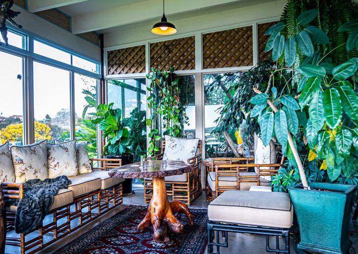 Kick back and relax in the lush ocean lounge at the Whale Inn and Restaurant, Narooma