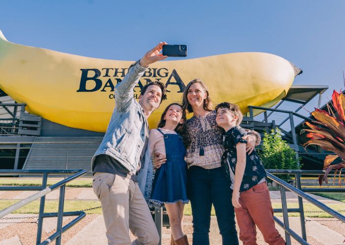 Family taking a selfie in front of The Big Banana, Coffs Harbour