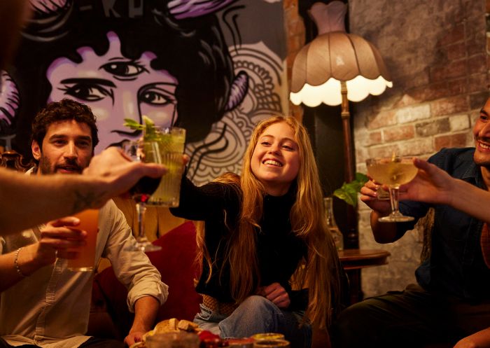 Group of friends enjoying drinks at Dark Arts Cafe & Bar, Coffs Harbour