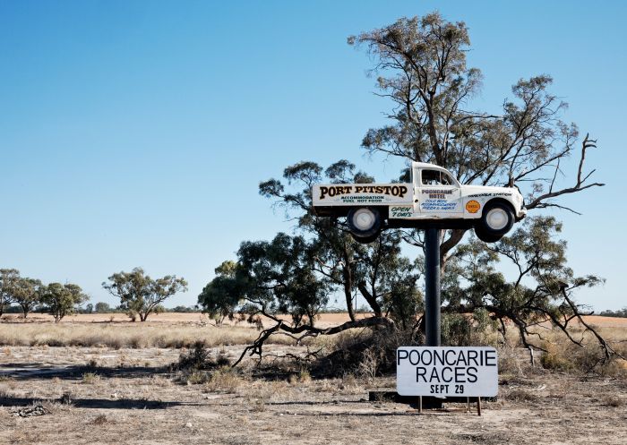 Ute advertising the Pooncarie Hotel Motel along the road near Menindee