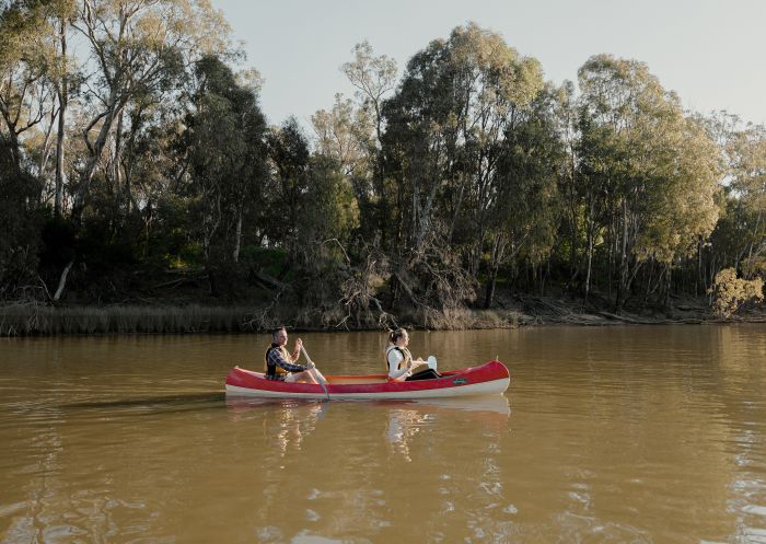 Couple enjoying a day of canoeing on the Murray River, Moama