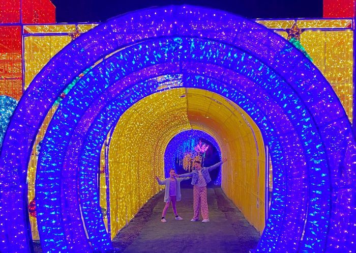 Dede and Gracie in Christmas light tunnel during the Christmas Carnival, Hunter Valley Gardens