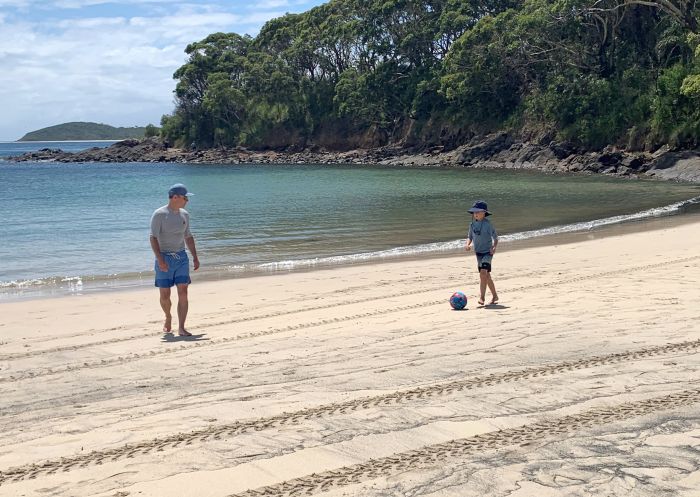 Ashton and his dad playing ball on the beach, Fingal Bay