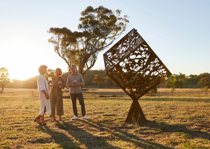 Couple enjoying a tour of the Sculptures in the Gardens with Amber Norton-Knight at Rosby Wines & Guesthouse, Eurunderee