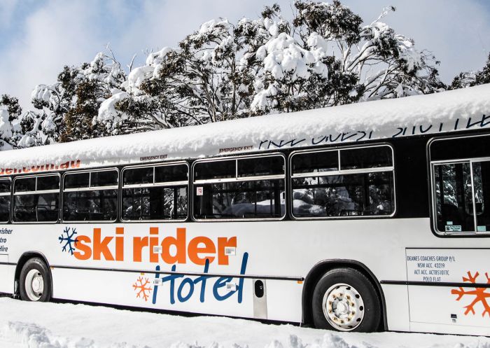 Hotel bus covered in fresh snow at Ski Rider Hotel, Kalkite