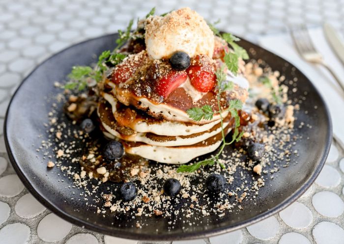 Pancakes with sticky date butterscotch and berries at The Press Shop Cafe, Bowral