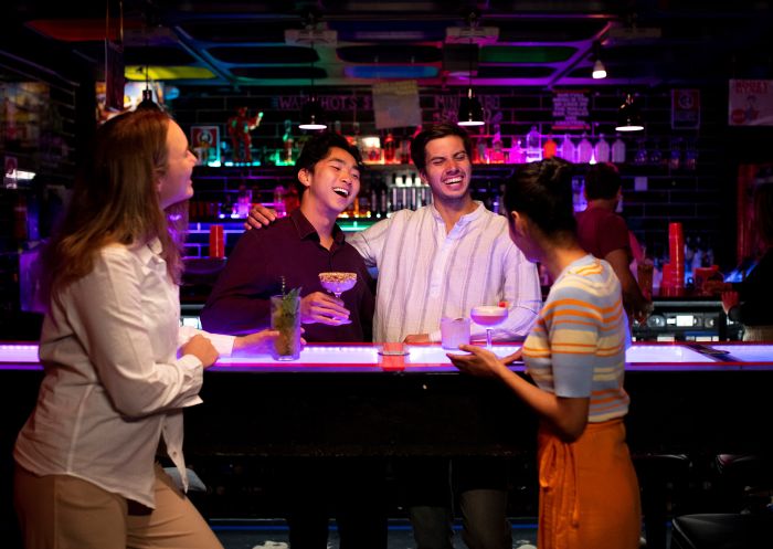 Group of friends enjoying bar at Uptowns Bar, Newcastle