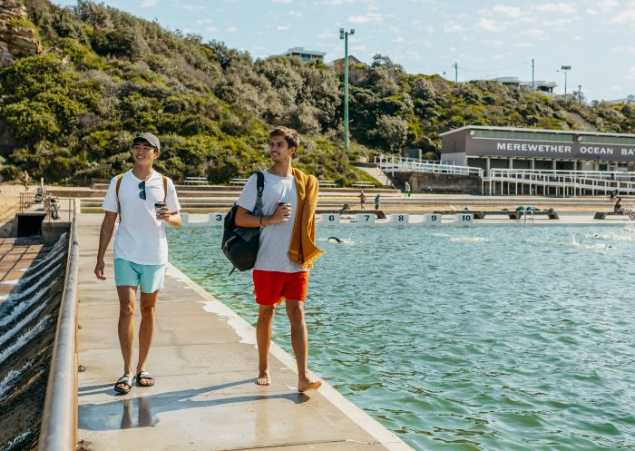 Friends walking along the pier at Merewether Ocean Baths, Merewether 