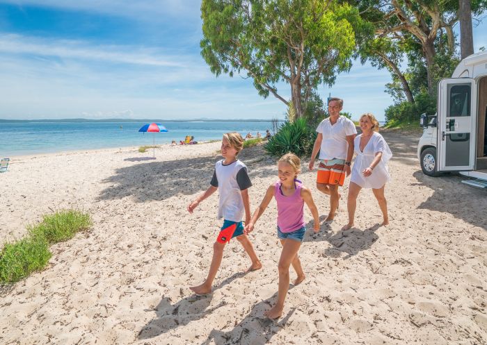 Family enjoying holiday at Tilligerry Creek at Koala Shores Port Stephens Holiday Park, Port Stephens