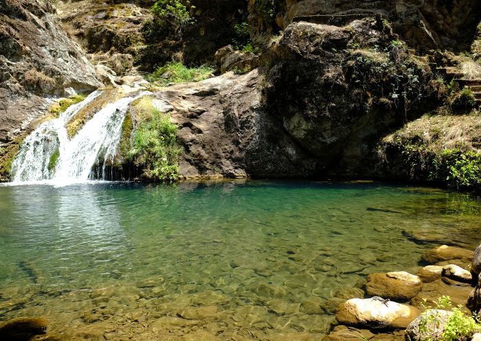 A small waterfall and natural waterhole on the Jenolan River walking track, below Blue Lake at Jenolan Caves, Blue Mountains