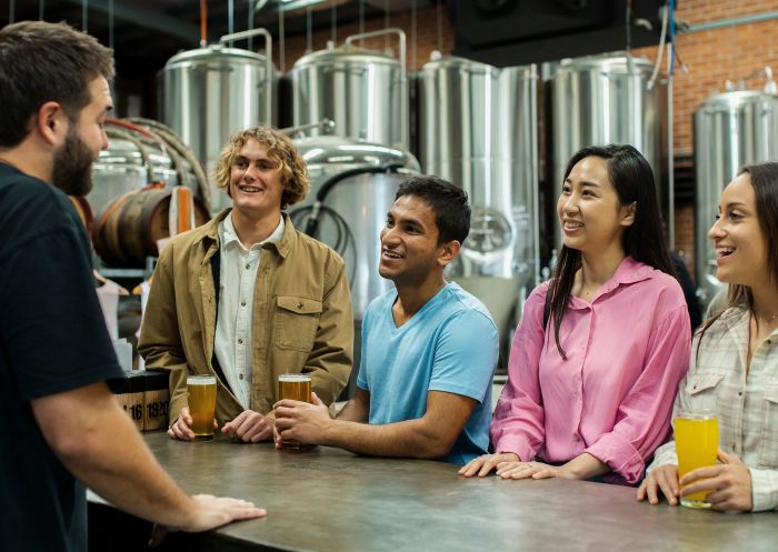 Friends enjoying a beer at Five Barrel Brewing, Wollongong