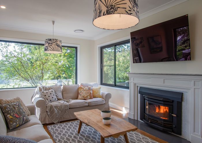 Living room with fireplace at Cadogan Country House, Orange