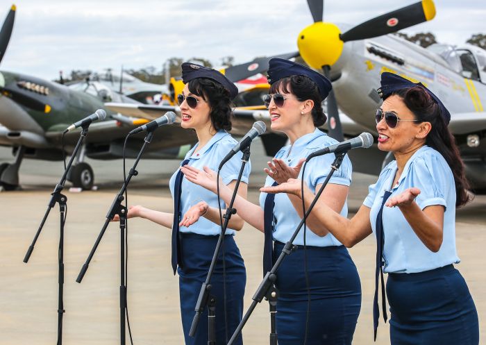 Singers performing on the tarmac at Warbirds Downunder Airshow 2018, Temora