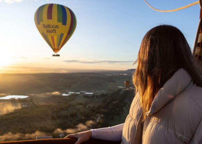 Woman gazing at the sunrise view with Balloon Aloft, Hunter Valley