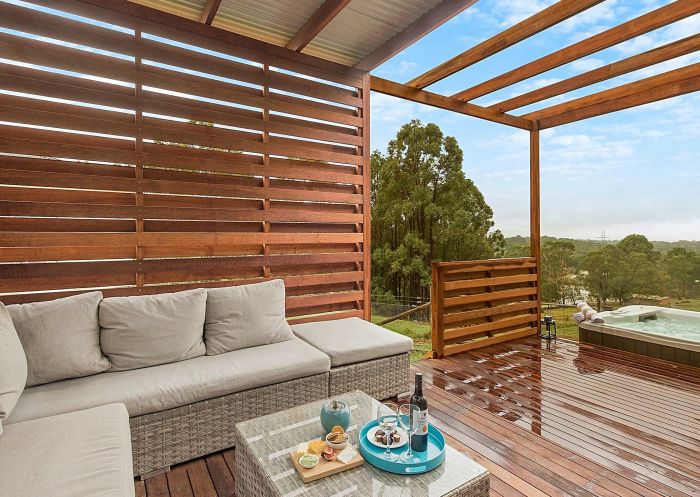 Relax at the outdoor lounge area near hot tub at Blueberry Hills On Comleroy, Kurrajong 