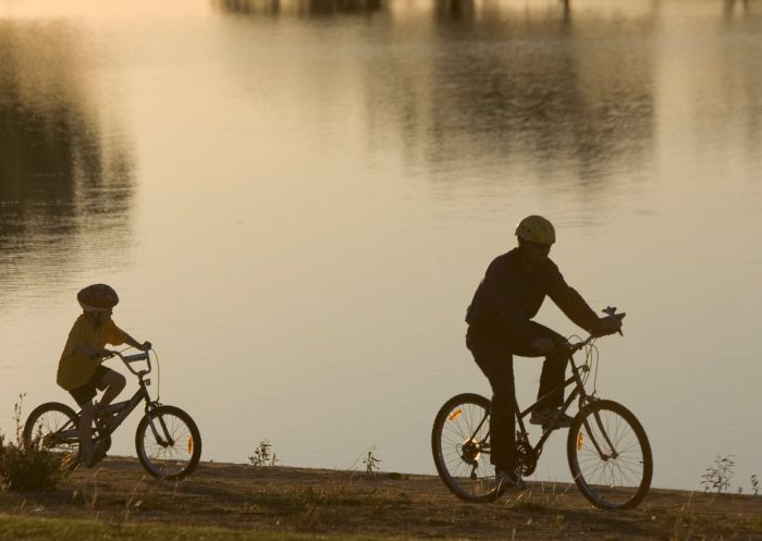People cycling along Lake Centenary, Temora