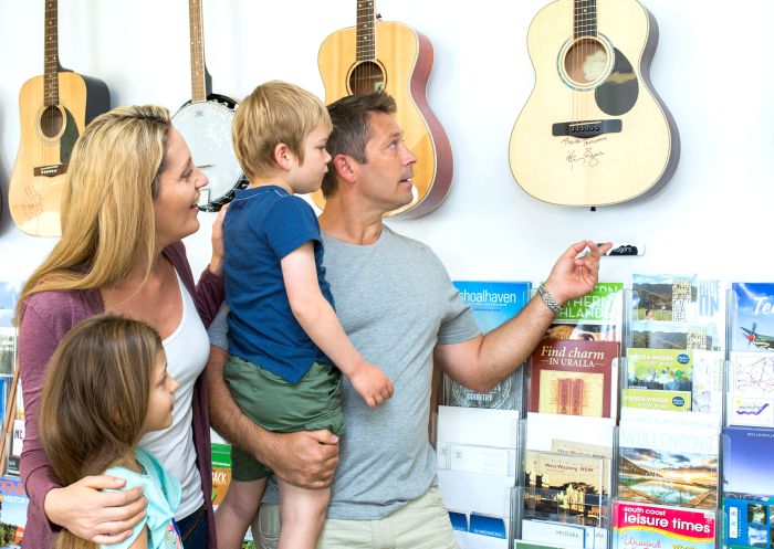 Family enjoying a visit -to The Big Golden Guitar Tourist Centre, Tamworth