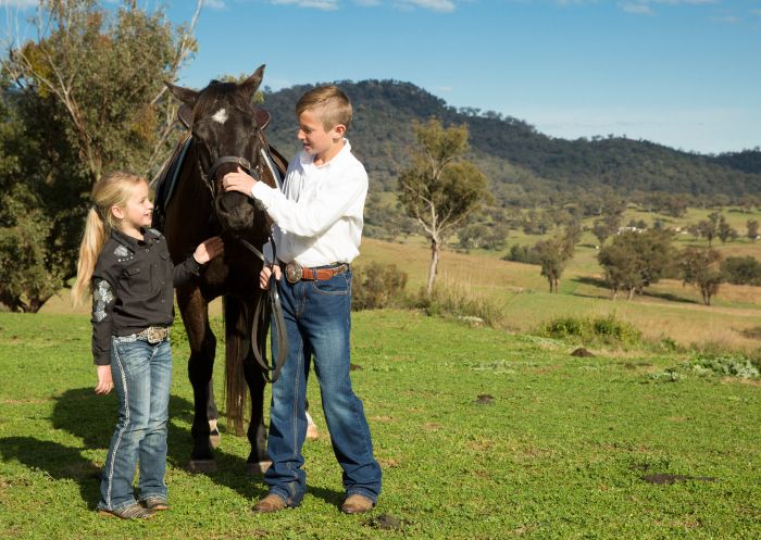 Children greeting their horse while on a guide tour with Tamworth & Kootingal Horse Riding Adventures, Tamworth