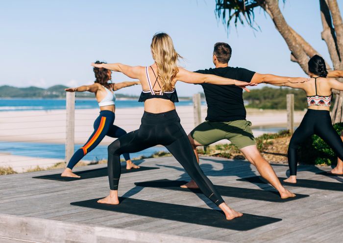 Elements of Byron guests enjoying morning beachfront yoga sessions, Byron Bay