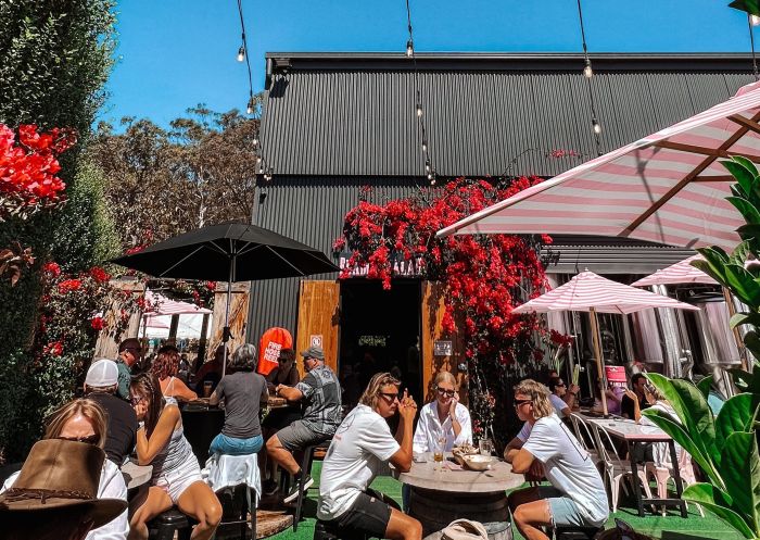 People enjoying lunch in the courtyard at Flamin Galah Brewing Co, Jervis Bay