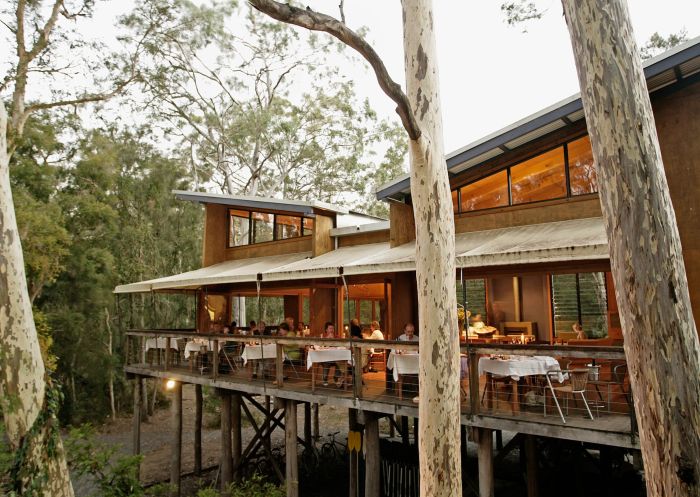 Outdoor dining at the Gunyah treetop dining room at Paperbark Camp, Jervis Bay