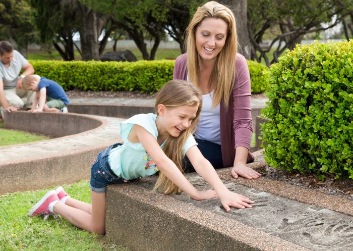 Family enjoying Hands of Fame Park at Australian Country Music Hall of Fame, Tamworth