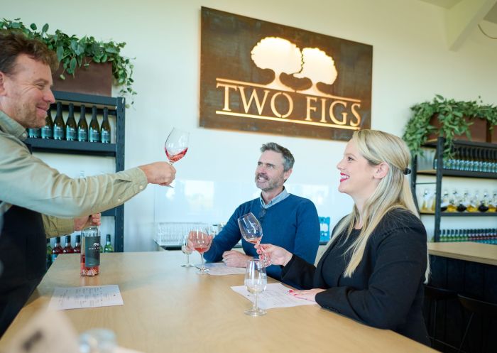 Couple enjoying wine tasting at Two Figs Winery, Berry