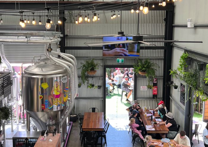 People enjoying lunch in the brewery at Flamin Galah Brewing Co, Jervis Bay