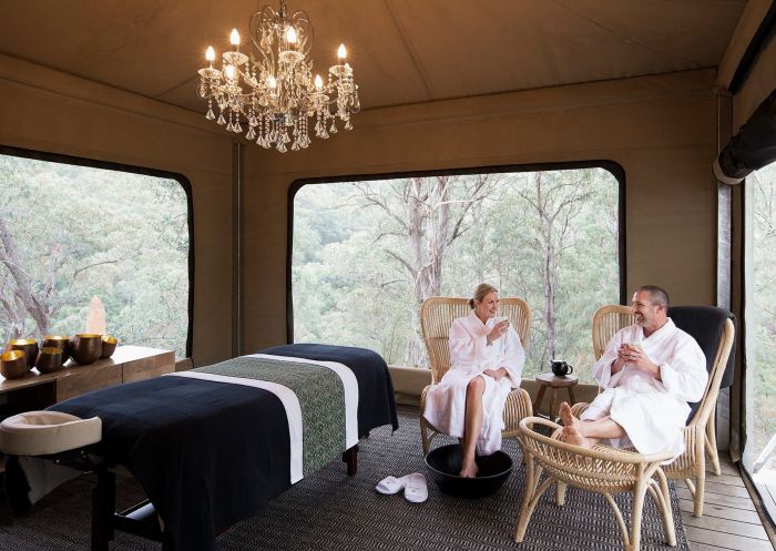 People enjoying tea in luxury massage tent at Spicers Sangoma Retreat, Bowen Mountain
