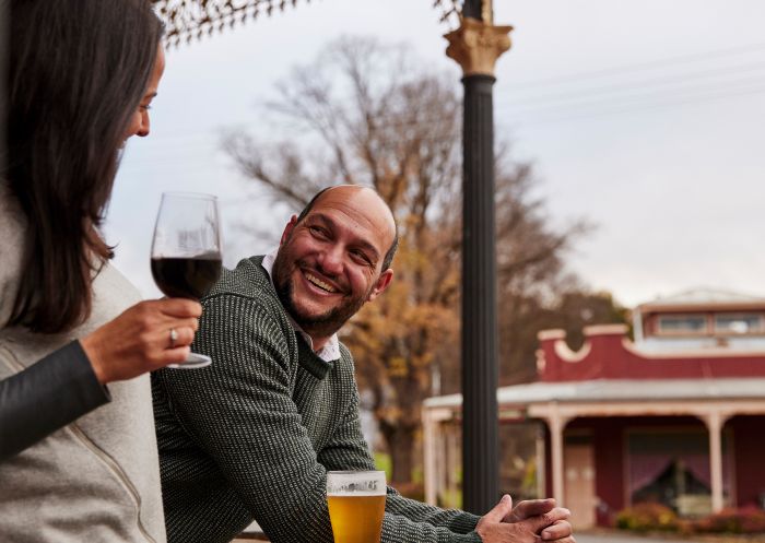 Couple enjoying a wine on the verandah at The Rockley Pub, Rockley