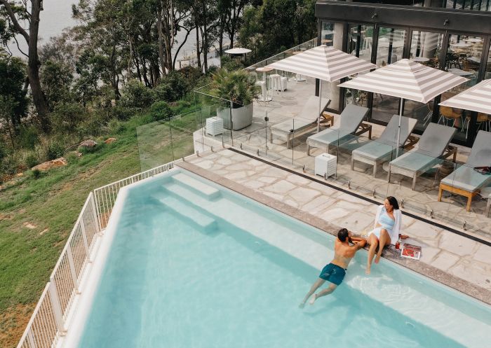 Couple enjoying the pool at Bannisters, Port Stephens