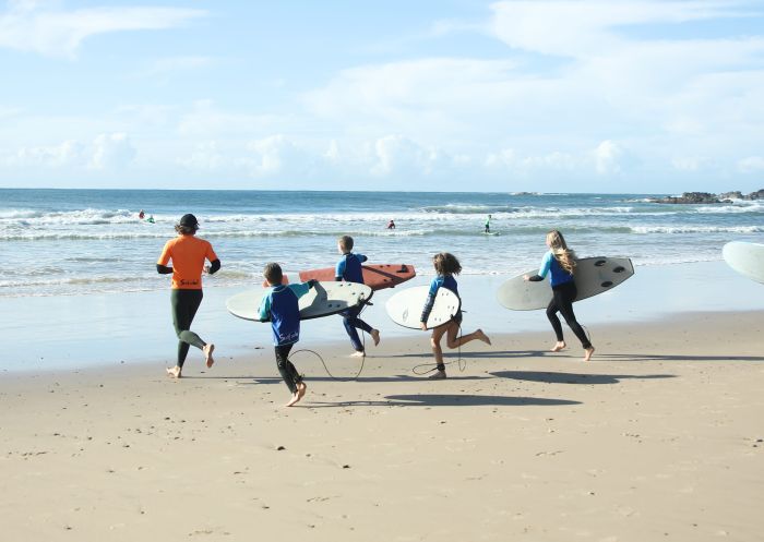 People learning to surf at Port Macquarie Surf School at Flynn's Beach, Port Macquarie