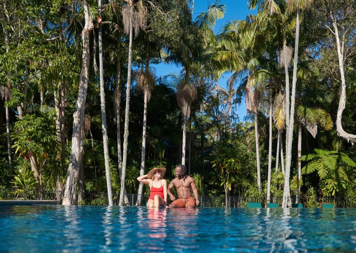 Couple enjoying the pool by the sub tropical rainforest at Crystalbrook, Byron Bay