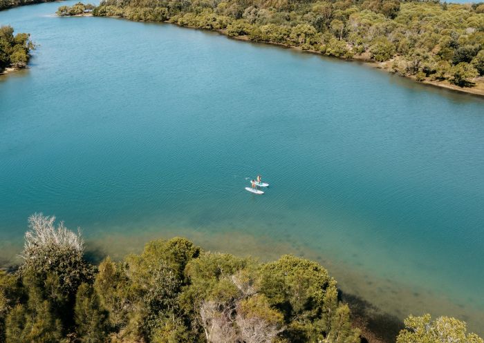 Couple enjoying a stand up paddleboarding, Fingal Head, Tweed Heads