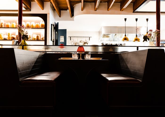 Booth seating with a view of the kitchen, Restaurant Santino, Wollongong - Credit: Tom Opie