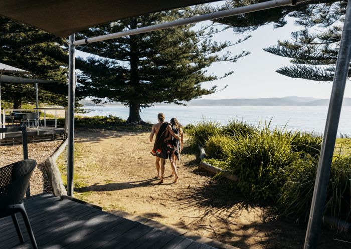 Young couple heading to the beach, NRMA Murramarang Beachfront Holiday Resort, South Durras