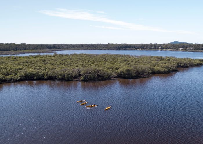 Aerial view of a small group kayaking, Myall Lakes, Hawks Nest
