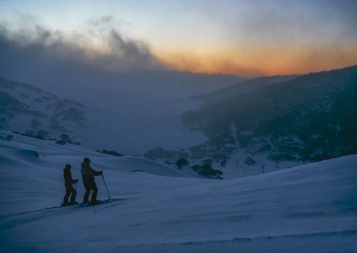 Couple enjoying a day of skiing, Charlotte Pass Ski Resort, Snowy Mountains