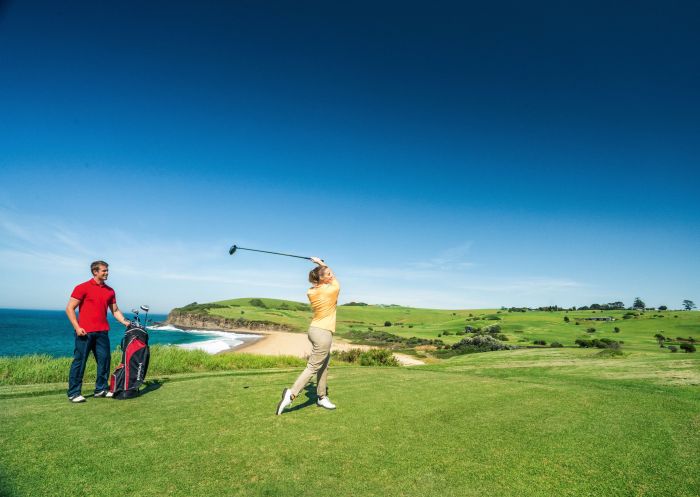 Couple enjoying a scenic round of golf, Kiama Golf Club, Kiama