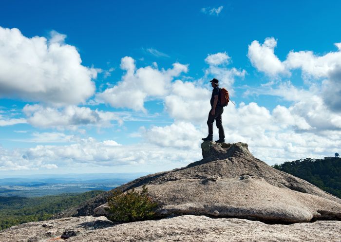 Man standing on rock, Cathedral Rock National Park, Ebor - Credit: Don Fuchs