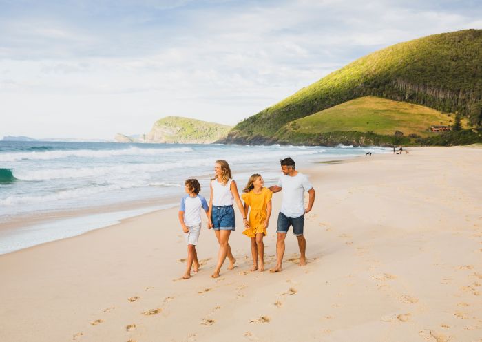 Family walking on the beach, Blueys Beach